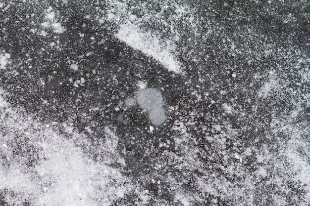Foto superficie di un'isola testurizzata del lago ghiacciato. avvicinamento.