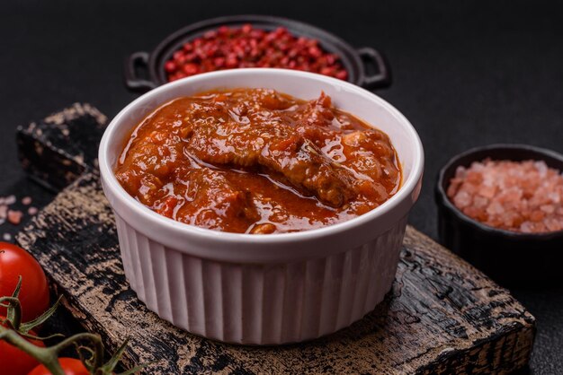 thai asian dish with meat hot pepper tomato sauce and sesame