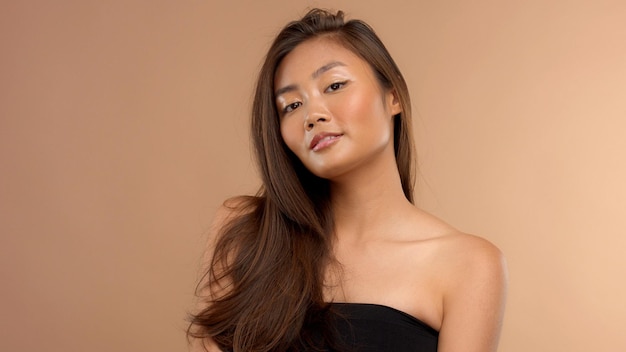 Thai asian model with natural makeup on beige background