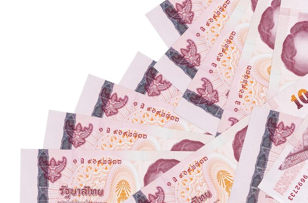 Thai Baht bills laying in different order on white surface