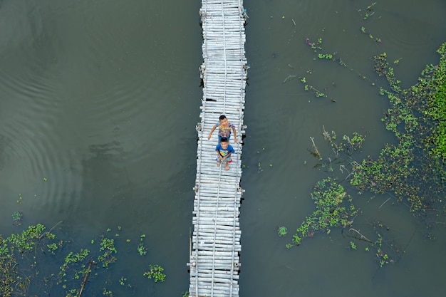 Thai childhood activity next to the lotus pond.