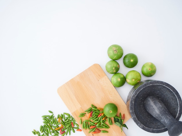 Thai cooking ingredients with mortar, pestle.