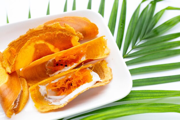 Thai crispy pancakes on white background