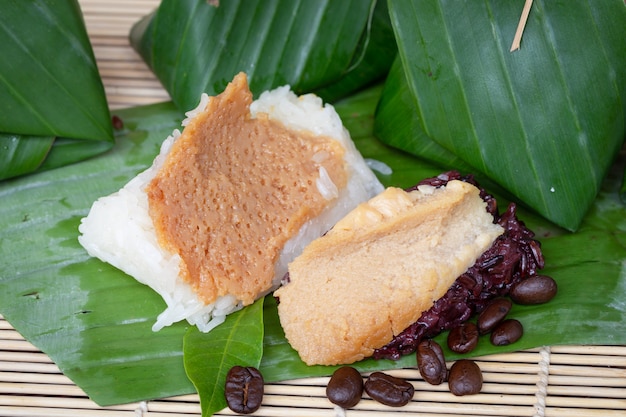 Thai custard black sticky rice dessert on banana leaf