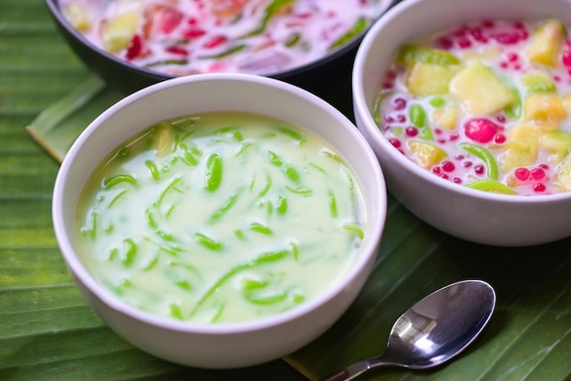 Thai dessert thai rice flour pandan leaf with coconut milk and syrup sweets dessert on white bowl asian food