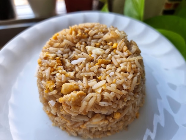 Thai egg fried rice on a white plate