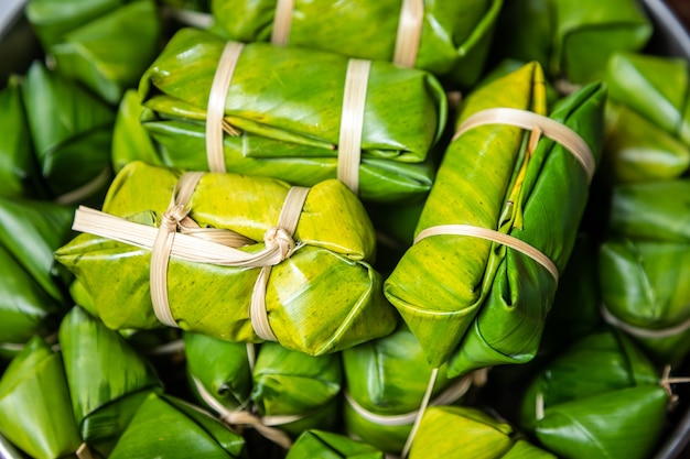 Thai filled with coconut milk and banana, Thai dessert, Cultivated banana.