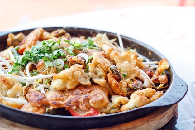 Thai food, fried mussel pancake in hot pan