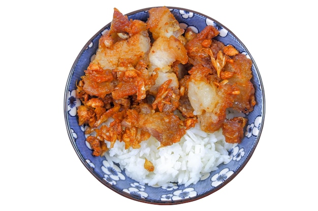 Thai food Fried pork with sliced garlic on rice white background