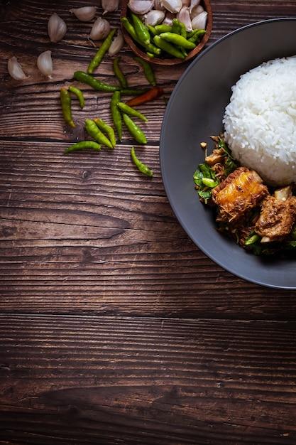 Thai food, Rice topped with stir fried basil and pork bone.