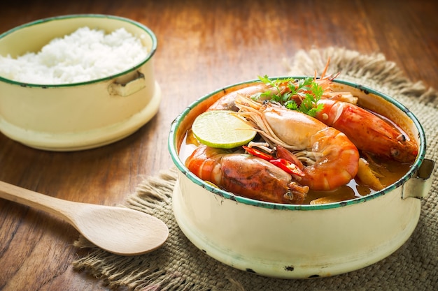 Thai food, river prawn spicy soup or tom yum goong on wooden table