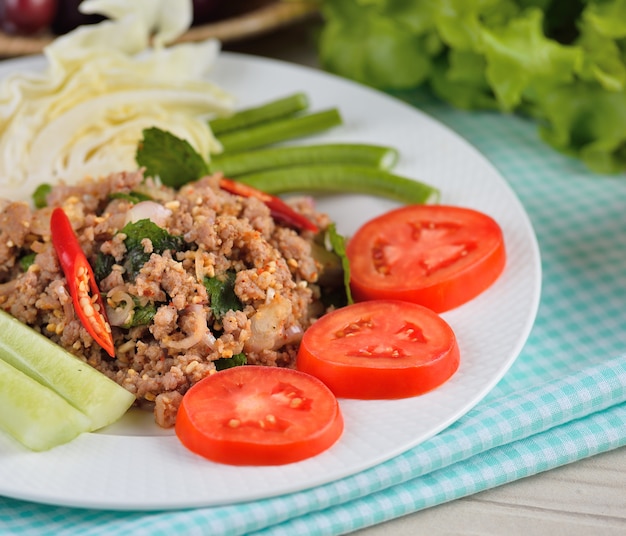 Thai food, spicy pork with chili and mint