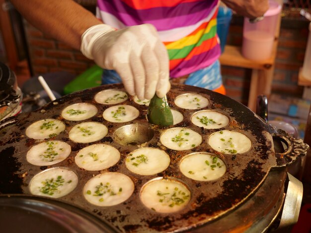 Photo thai food sweet coconut desert that call khanom khrok or
coconut-rice pancakes