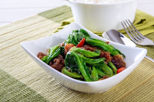 Thai food or thai cuisine, Stir fried kale with crispy pork with rice.