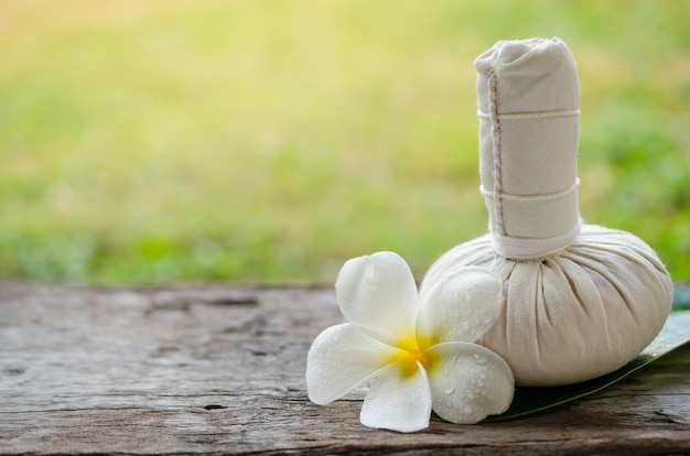 Photo thai herbal compress for spa and a flower