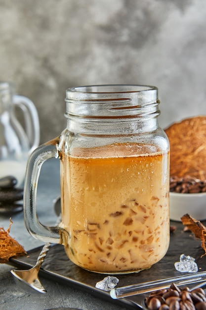 Thai Iced Coffee with Coconut Milk with Crushed Ice in a Mason Jar