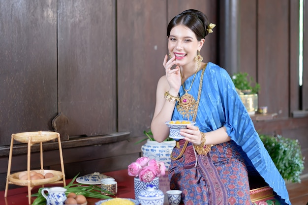 Thai people make Thai dessert in Thai period costume