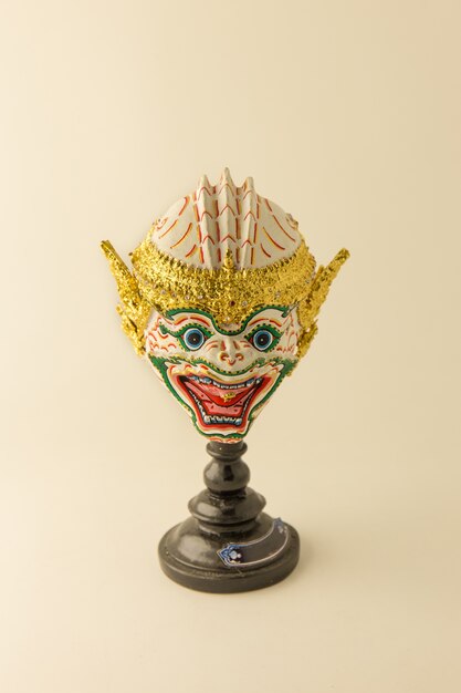 Thai ramayana mask figurine in warm tone