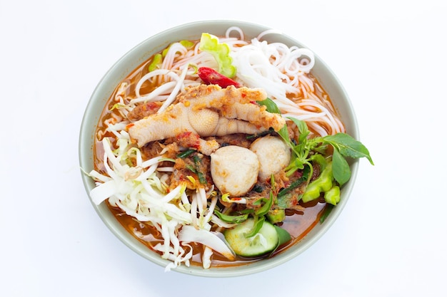 Thai rice noodle with chicken feet curry and fish balls