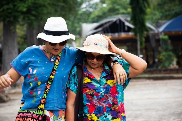 Thai senior mother and young daughter women travel visit and posing portrait for take photo 