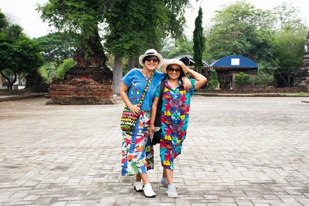 Thai senior mother and young daughter women travel visit and posing portrait for take photo 