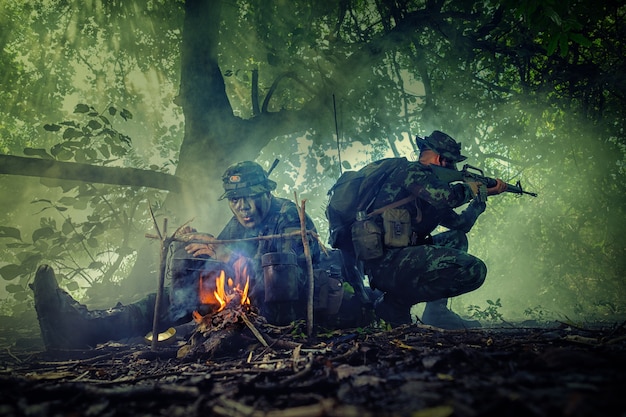 Thai soldier holding gun in full arm