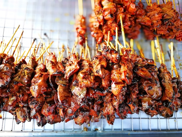 Thai street food grilled chicken stick in flea market