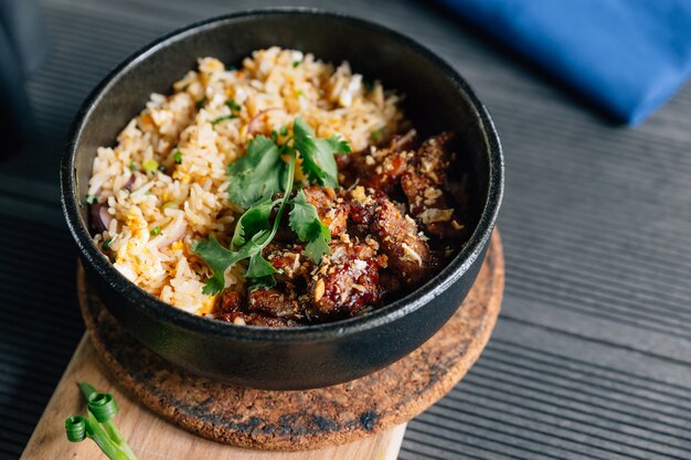 Thai style grilled pork fried rice served with Thai spicy dipping sauce.