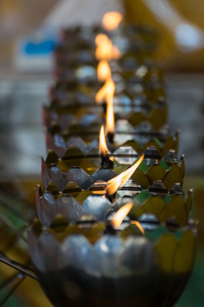 Photo thai style metal candle lantern in thai temple