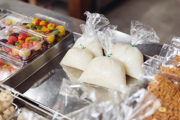 Thai sweet sticky rice wrap in plastic, ready to sell.