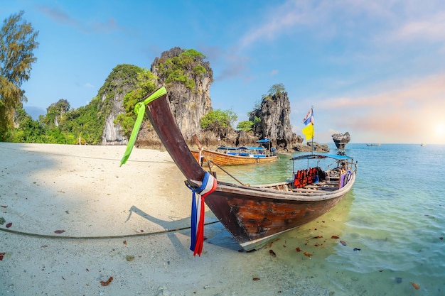 Thai traditional colorful wooden longtail boat and beautiful sand beach in Thailand