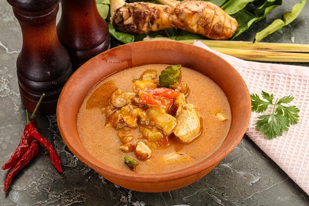 Thai traditional Tom Yum spicy soup with chicken