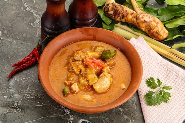 Thai traditional Tom Yum spicy soup with chicken