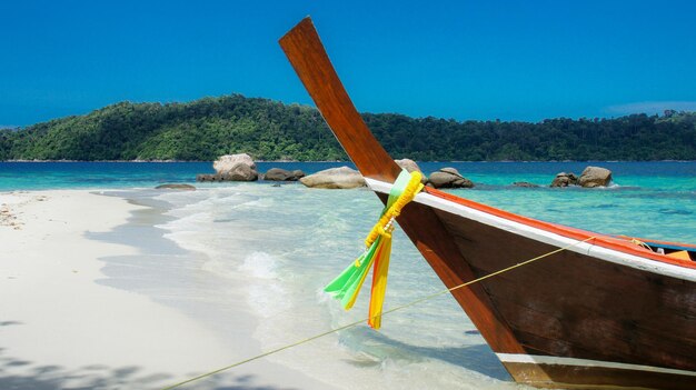 Thai traditional wooden longtail boat on the beach beautiful thailand landscape