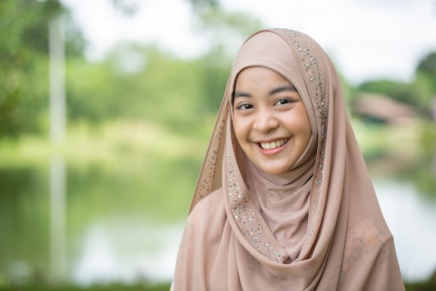 Thai woman muslim portrait smile and happy in the outdoor.