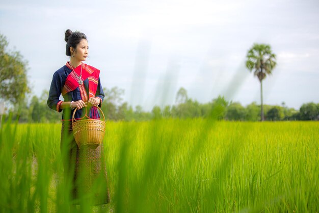 Thai women wearing traditional costumesThai beautiful woman in traditional dress costume outdoor