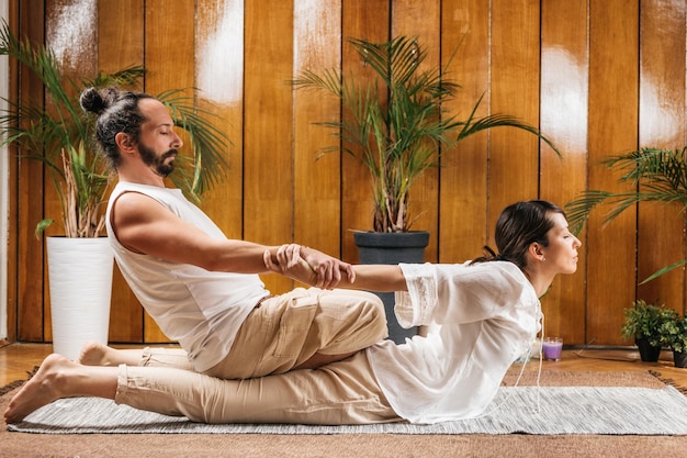 Thai Yoga Massage Stretching Female Patient in the Cobra Position