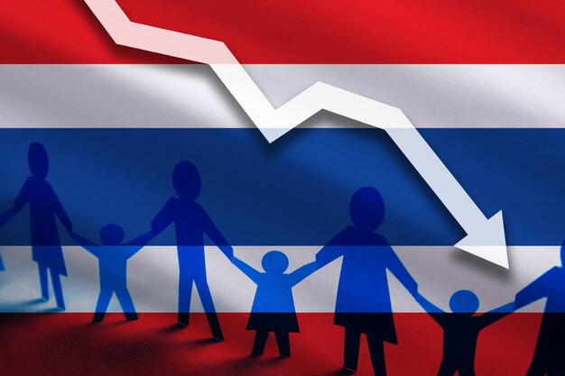 Photo thailand flag background of the arrow chart down decrease in the number of the countrys rape