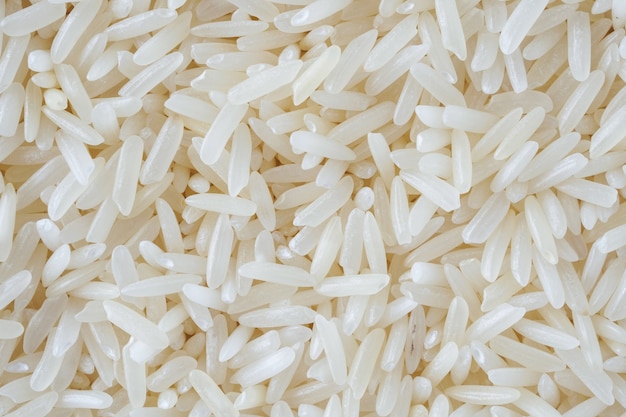 Thailand Jasmine rice grains texture background close up