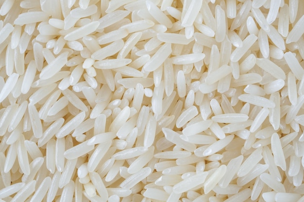 Thailand Jasmine rice grains texture background close up