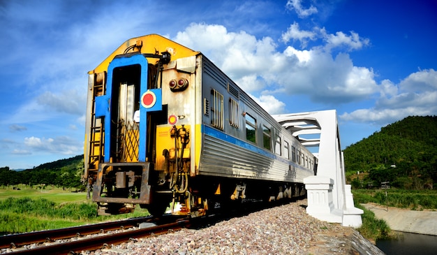 Thailand train passing white bridge