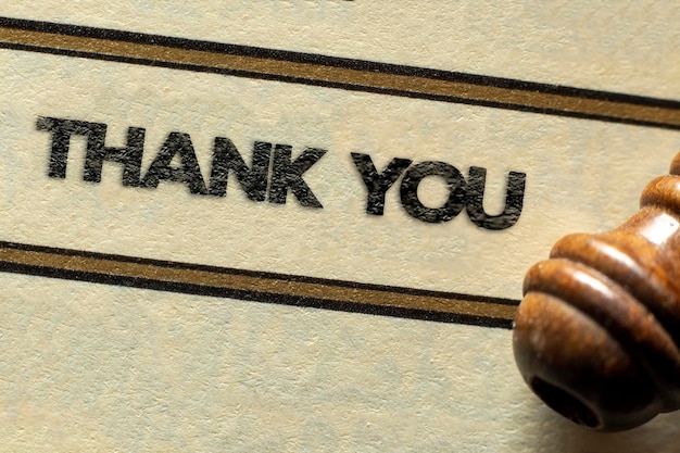Premium Photo | Thank you concept black thank you sign over paper