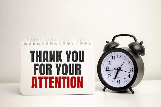 Thank Your For Your Attention words with calculator and clock with notebook