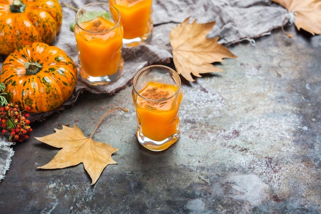 Thanksgiving autumn alcohol drink cocktail beverage with pumpkins and leaves