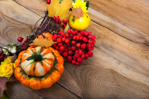 Thanksgiving background with pumpkin and mapple leaves wreath, copy space