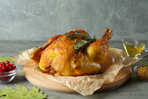 Thanksgiving Day roast turkey on gray textured table