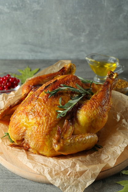 Thanksgiving Day roast turkey on gray textured table