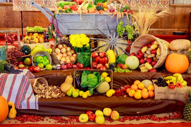 Thanksgiving day: Tray with pumpkin and different ripe vegetables inside