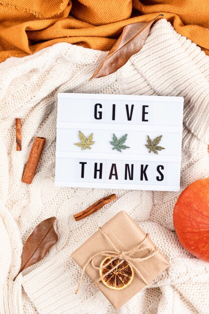 Thanksgiving flat lay composition with lightbox with the phrase Give thanks