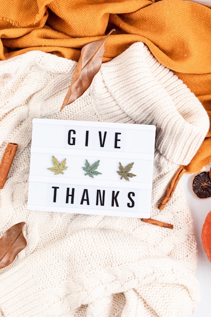 Thanksgiving flat lay composition with lightbox with the phrase Give thanks